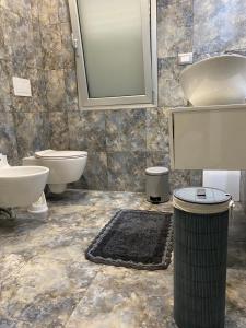 Kúpeľňa v ubytovaní Akoya Rooms Capo Vaticano