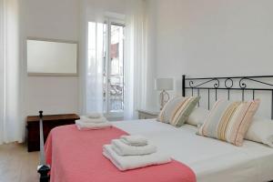Кровать или кровати в номере Vicolo Cellini