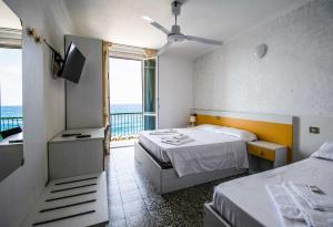 Voodi või voodid majutusasutuse Hotel San Pietro Chiavari toas