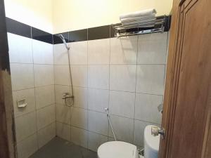Kylpyhuone majoituspaikassa Hotel Manggala Syariah