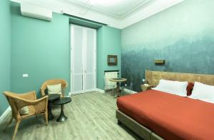 A bed or beds in a room at Household Settembrini