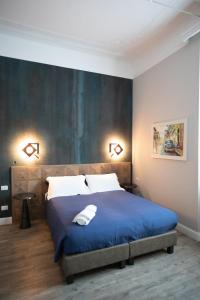 A bed or beds in a room at Household Settembrini