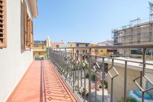 a balcony of a building with plants on it at Casa Olimpia in Santa Teresa di Riva