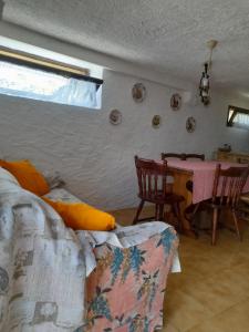 a living room with a couch and a table at Baita Martin da Fist in Caderzone Terme