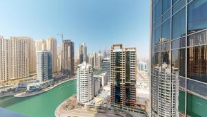 a view of a city with a river and buildings at Key View - Emaar Residences, Marina Mall in Dubai