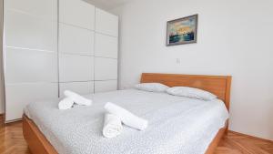 Posteľ alebo postele v izbe v ubytovaní Opatija 10 Apartment with parking, 300m to the sea