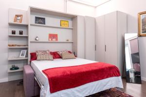 A bed or beds in a room at Household Settembrini