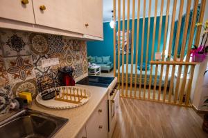 a kitchen with a sink and a counter top at Efie's Studio in Kalamata