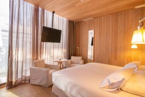 Postel nebo postele na pokoji v ubytování Hotel Magnolia Santiago