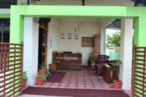 an entrance to a reception area of a building at Hotel Stay Shine in Mysore