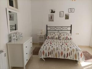 Posteľ alebo postele v izbe v ubytovaní Apartamento O Vento
