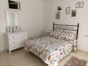 Posteľ alebo postele v izbe v ubytovaní Apartamento O Vento