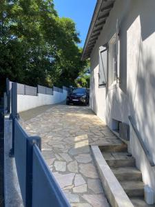 a car parked in a parking lot next to a building at Proximité Biarritz - Arcangues in Arcangues