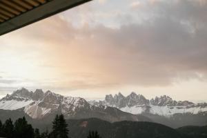 a view of a mountain range with snow at anders mountain suites 6 in Brixen