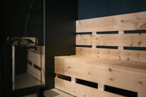 a wooden wall in a room with a drawer at anders mountain suites 6 in Brixen