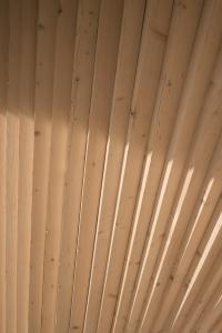 a ceiling of a room with wooden ceilings at anders mountain suites 6 in Brixen