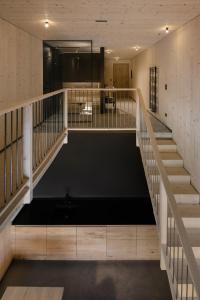 a large room with stairs and a pool at anders mountain suites 6 in Brixen
