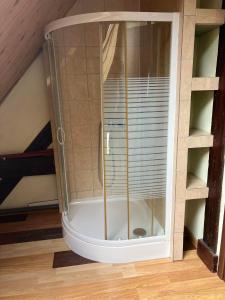 a shower in the corner of a room at Hostel BAZA 15 in Wrocław