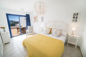 Postel nebo postele na pokoji v ubytování Coloradas Villa Alba + 22 fotografií