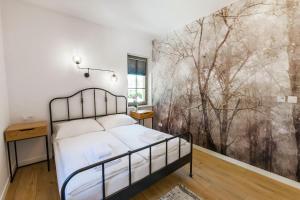 Posteľ alebo postele v izbe v ubytovaní VacationClub - Stone Hill Apartament 5