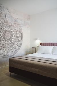 Postel nebo postele na pokoji v ubytování Olea Relais