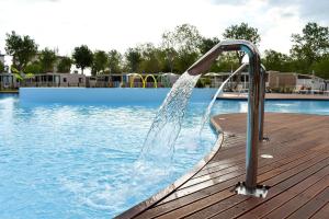 a water slide in a swimming pool at Club del Sole Rimini Family Resort in Rimini