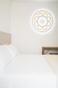 Postel nebo postele na pokoji v ubytování Olea Relais