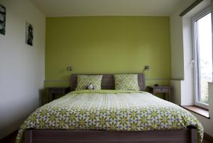 Postel nebo postele na pokoji v ubytování B&B Die Alte Scheune