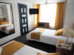 Letto o letti in una camera di Hotel Rincón Escandinavo