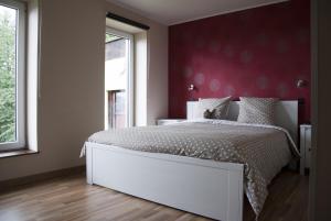 Postel nebo postele na pokoji v ubytování B&B Die Alte Scheune