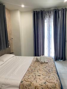 Posteľ alebo postele v izbe v ubytovaní Akoya Rooms Capo Vaticano