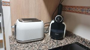 a toaster and a toaster sitting on a counter at Precioso Estudio en Arroyo de la Miel . Centro in Benalmádena