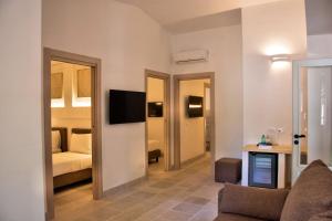 A television and/or entertainment centre at Gattarella Family Resort Puglia- Seaside Rooms and Suites with Premium Half-Board à la carte