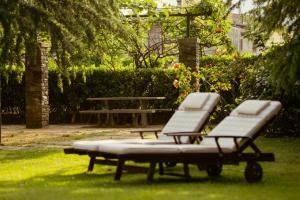 two chairs and a picnic table in a park at Villa Dervio in Dervio +13 photos