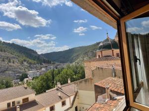 a view of a city from a window at El mirador de María in Alcalá del Júcar