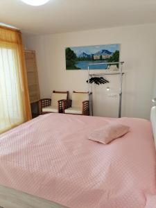 Postel nebo postele na pokoji v ubytování KIKA
