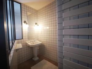 a bathroom with a sink and a mirror at Le Moulin de Villiers in Gudmont