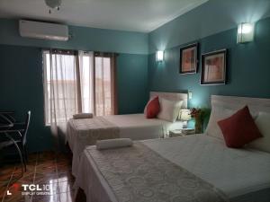 Voodi või voodid majutusasutuse Hotel Vista del Mar toas