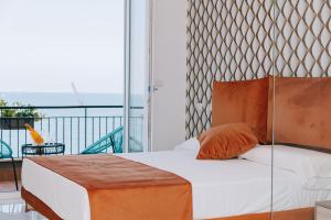 Letto o letti in una camera di FronteMare Suite