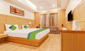 Postel nebo postele na pokoji v ubytování Treebo Galaxy Rooms