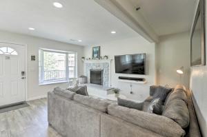 a living room with a large couch and a fireplace at Epic Lake Tahoe Getaway Heavenly Daze Chalet in Stateline