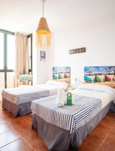 Postel nebo postele na pokoji v ubytování Hotel Doña Matilde