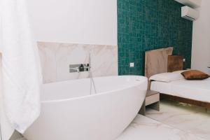 Letto o letti in una camera di FronteMare Suite