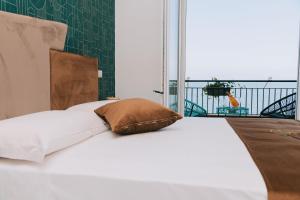 Letto o letti in una camera di FronteMare Suite