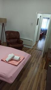 a room with a bed and a couch and a chair at ANI Apartments Banja Luka in Banja Luka