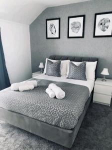 a bedroom with a bed with two pillows on it at Fieldside View, Contractors and Families in Doncaster