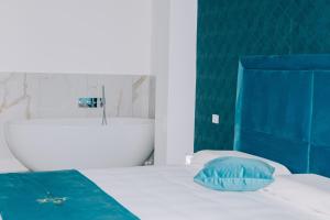 Letto o letti in una camera di FronteMare Suite