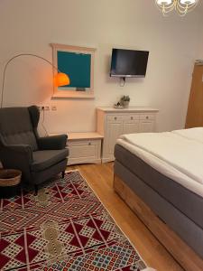 TV a/nebo společenská místnost v ubytování Hotel Neuhauser