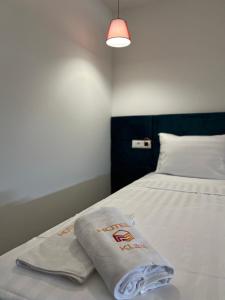 Postel nebo postele na pokoji v ubytování Kubi Hotel