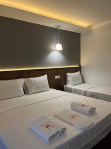Postel nebo postele na pokoji v ubytování Kubi Hotel